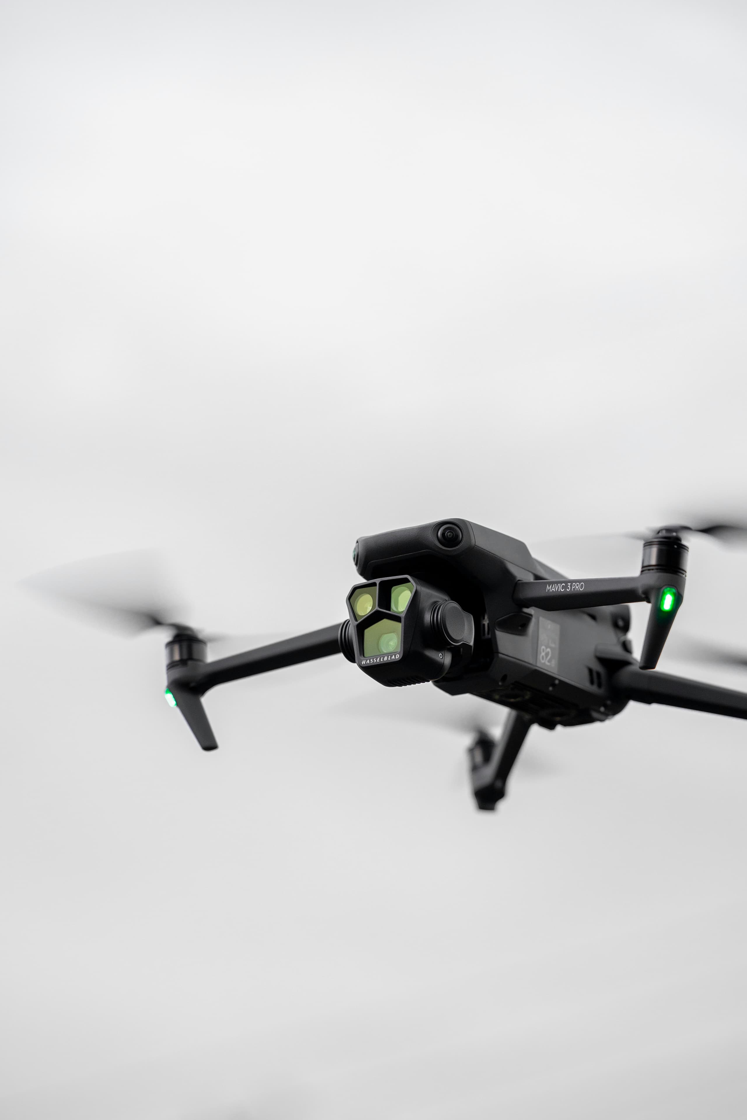 Pilot launching a drone from a meadow