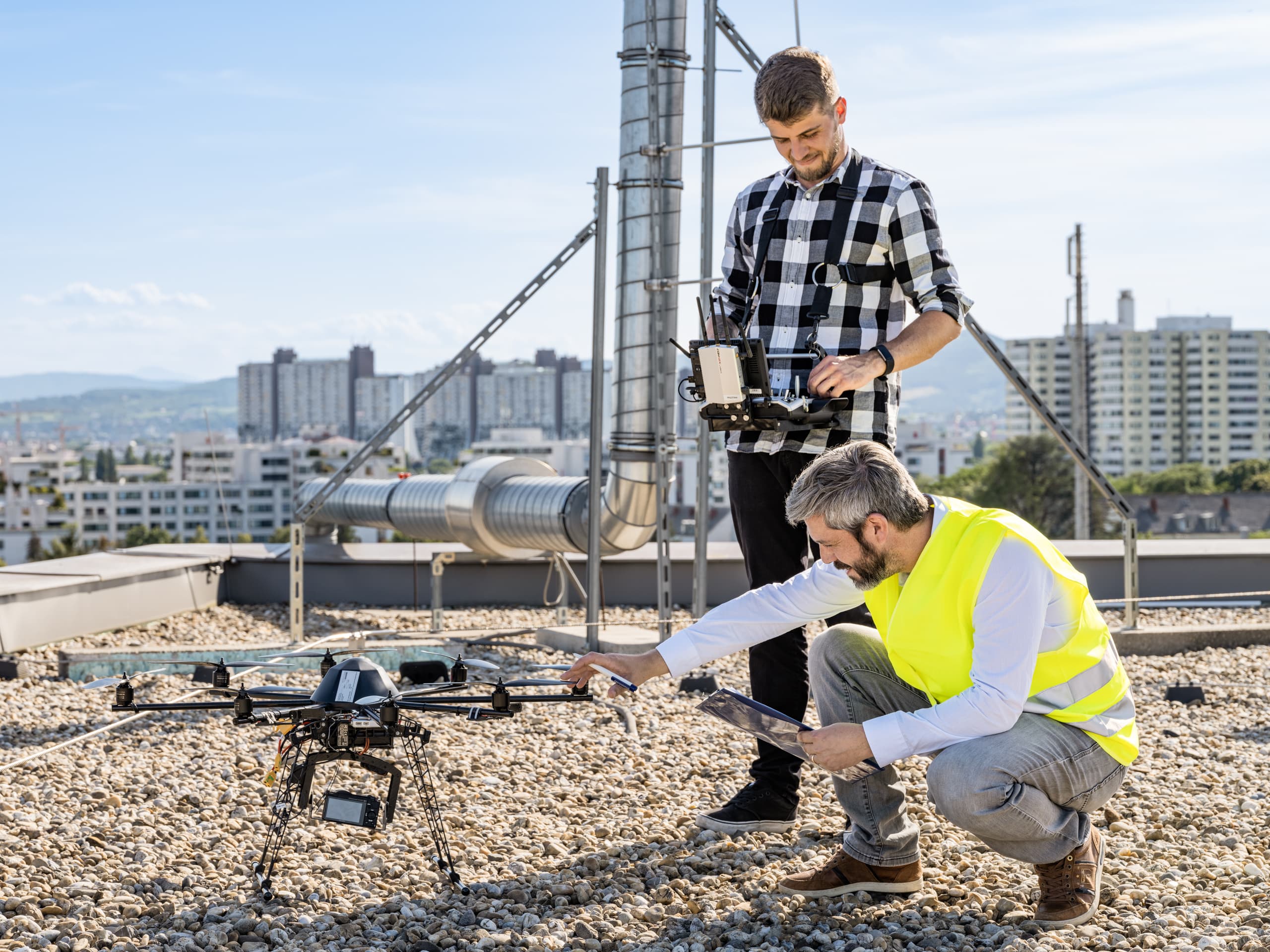 Drone pilot operating a drone in a field